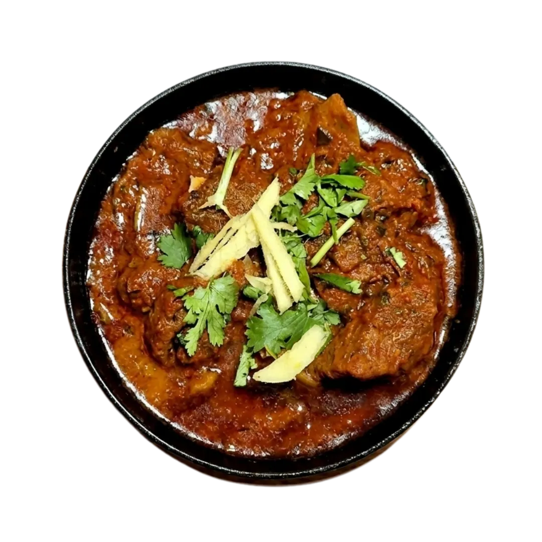 Lamb curry garnished with ginger and coriander
