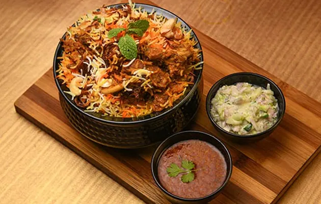 Biryani served on a wooden board