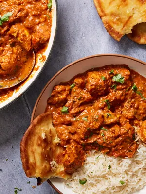 Butter chicken with naan and rice