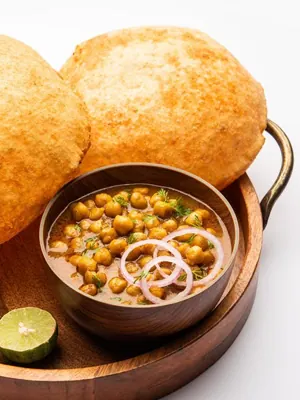 Chole bhature with onion and lemon
