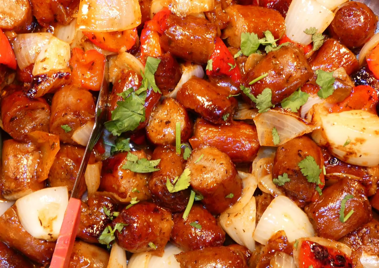 Spicy sausage stir-fry with peppers, onions and coriander