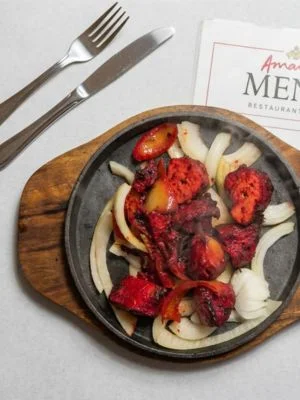 Tandoori chicken on a sizzling plate